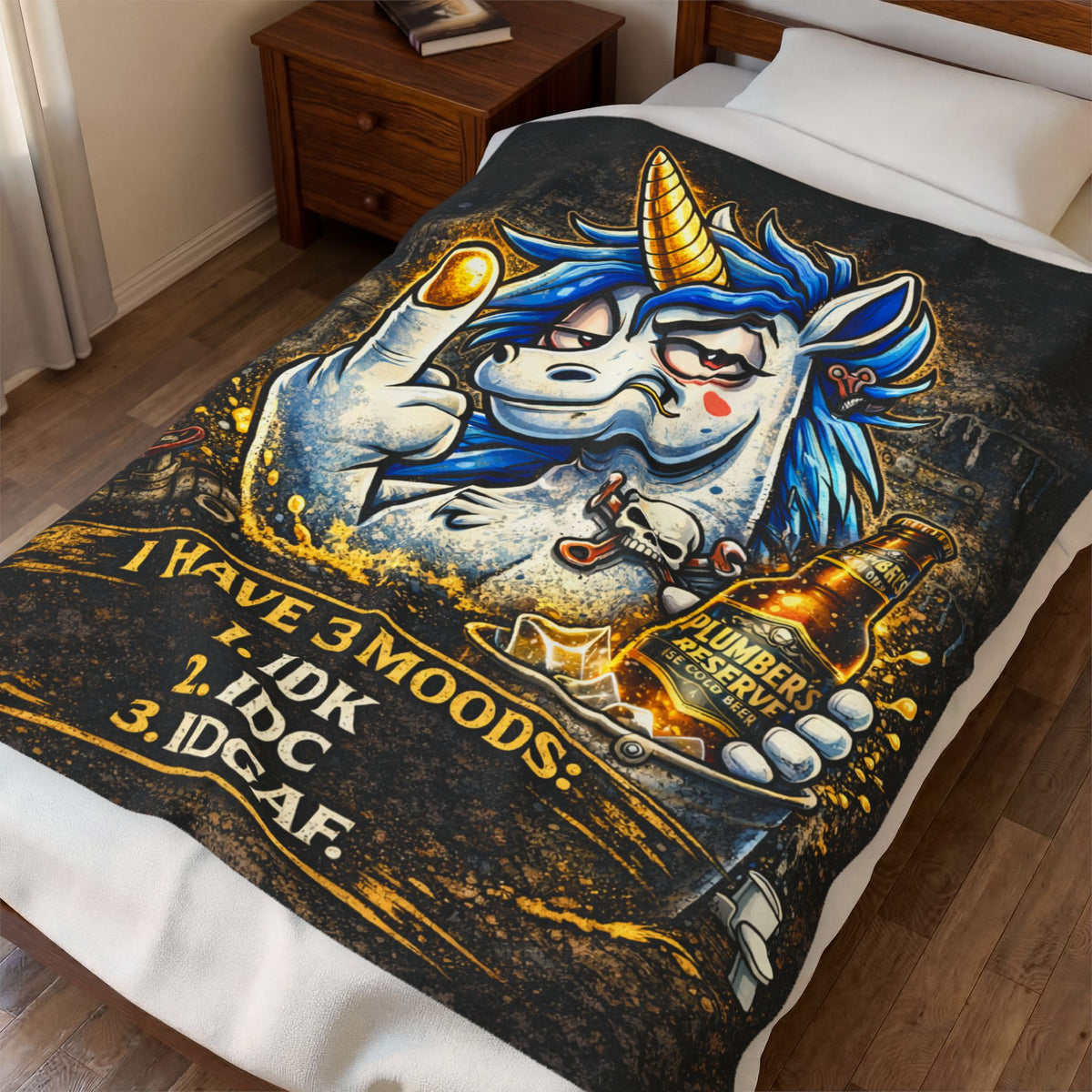 Close-up of 3 Moods blanket showing unicorn artwork, beer bottle, and IDK IDC IDGAF printed design